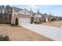 Beautiful brick home with two-car garage, long driveway, and well-kept lawn at 3750 Montebello Pkwy, Cumming, GA 30028