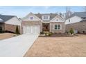 Beautiful brick home with two-car garage, landscaped front yard, and welcoming curb appeal at 3750 Montebello Pkwy, Cumming, GA 30028