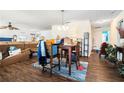 Open-concept room showcasing hardwood floors, a dining area, and ample space for entertaining at 691 Mount Tabor Rd, Oxford, GA 30054