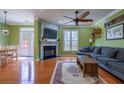 Bright living room with hardwood floors, a fireplace, and a comfortable seating area at 4779 Longcourt Dr # 21, Atlanta, GA 30339