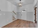 Inviting entryway with hardwood floors, wainscoting, and a view of the staircase at 131 Old Alabama Se Rd, Emerson, GA 30137