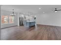 Open-concept living space with a modern kitchen featuring a large island and stainless steel appliances at 131 Old Alabama Se Rd, Emerson, GA 30137