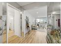 Inviting entryway leading into a bright living room with mirrored accents and light floors at 215 Piedmont Ne Ave # 308, Atlanta, GA 30308
