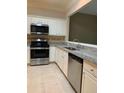 Well-lit kitchen with stainless steel appliances, granite counters, and white cabinets at 2394 Elkhorn Ter, Duluth, GA 30096
