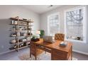 Home office with a large desk and bookcase at 11338 Musette Cir, Alpharetta, GA 30009