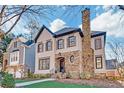 Charming two-story home with stone accents and well-maintained landscaping at 1527 Markan Ne Dr, Atlanta, GA 30306