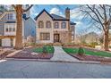 Charming two-story home features meticulous landscaping and an inviting entrance at 1527 Markan Ne Dr, Atlanta, GA 30306