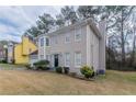 Side view of a two story house showing yard and bay window at 3174 Palm Tree Dr, Lithonia, GA 30038