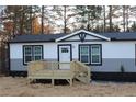 This home offers a nice front porch deck, perfect for enjoying your new home at 7382 Knox Bridge Hwy, Canton, GA 30114