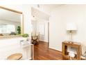 Bright hallway leading to the dining area with hardwood floors and neutral walls at 100 Biscayne Nw Dr # 4, Atlanta, GA 30309