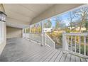 A spacious covered porch with a view of the property's landscape and surrounding neighborhood at 437 Westmeath Sw Dr, Atlanta, GA 30310