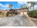 Spacious backyard with brick house, including a two-car garage, enclosed porch, and a basketball hoop at 3354 Wakefield Dr, Decatur, GA 30034
