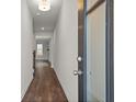 Inviting entryway with wood-look floors and natural light, creating a warm and welcoming ambiance at 706 Smokey Quartz Way, Kennesaw, GA 30144