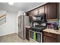Well-equipped kitchen features stainless steel appliances and ample countertop space at 11765 Fairway Overlook, Fayetteville, GA 30215