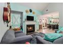 Inviting living room featuring a fireplace, comfortable seating and dining area at 11765 Fairway Overlook, Fayetteville, GA 30215