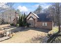 Charming Tudor style home with brick and stone, professional landscaping and mature trees at 3000 Cathedral Pl, Decatur, GA 30034