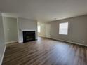 Bright living room featuring a fireplace and beautiful laminate flooring at 104 Westland Sw Ct, Marietta, GA 30064