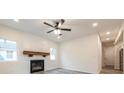 The living room features a wooden mantle fireplace, plank feature wall, and recessed lighting at 1467 Lockwood Sw Dr, Atlanta, GA 30311