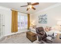 Cozy living room with a comfortable couch, bright window, and neutral carpet at 445 Edenbrooke Way, Roswell, GA 30075