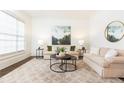 Cozy living room featuring plush seating, stylish decor, and an area rug at 765 Glengate Pl, Atlanta, GA 30328