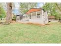 Charming home featuring a quaint covered porch, gray siding and freshly painted white brick at 2769 Glenwood Se Ave, Atlanta, GA 30317