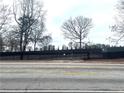 Street view of the property with a view of a long black fence at 2769 Glenwood Se Ave, Atlanta, GA 30317