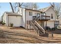 View of backyard showcasing a wood deck with stairs leading to the yard at 5303 Martins Crossing Rd, Stone Mountain, GA 30088