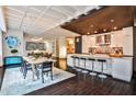 Spacious open kitchen with breakfast bar, modern appliances, and adjacent dining area at 805 Peachtree Ne St # 317, Atlanta, GA 30308