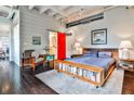 Comfortable bedroom with ensuite bathroom, exposed ceilings and industrial modern accents at 805 Peachtree Ne St # 317, Atlanta, GA 30308
