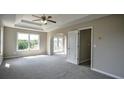 Bright and spacious bedroom with carpeted floors and plenty of natural light at 907 Southfork Dr, Loganville, GA 30052