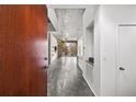Modern condo entryway featuring polished concrete floors and an open floor plan at 130 Arizona Ne Ave # 106, Atlanta, GA 30307