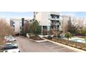 Modern condo building exterior with a swimming pool and parking at 130 Arizona Ne Ave # 106, Atlanta, GA 30307