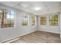 Bright room with natural light, modern flooring, and four large windows offering ample views of the outdoor scenery at 3581 Midway Rd, Decatur, GA 30032