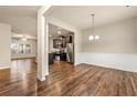 Open-concept living room with hardwood floors and a view into the kitchen at 6040 Oakley Rd, Union City, GA 30291