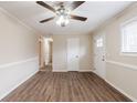Bright living room featuring modern wood-look floors and neutral wall colors at 8673 Chestnut Ln, Lithia Springs, GA 30122