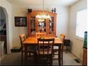 Cozy dining room with classic wooden furniture set, perfect for intimate Gathering meals at 443 Hannah Dr, Temple, GA 30179