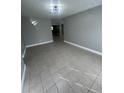 Spacious living room featuring tiled floors, neutral paint, and recessed lighting fixtures at 96 Sir Scott Ct, Lawrenceville, GA 30044