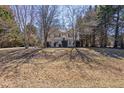 Inviting two-story home with a well-maintained front yard and mature trees providing shade at 255 N Loblolly Xing, Temple, GA 30179