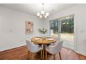 Cozy dining area with a view of the backyard with access to the wooden patio through glass sliding doors at 5935 Mountain Top Pl, Cumming, GA 30041