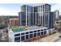 Luxury high-rise building with a rooftop pool, tennis court, and parking at 2425 Peachtree Rd # 1806, Atlanta, GA 30305