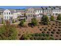 Beautifully landscaped community with well-maintained townhomes and lush greenery at 414 Montclair Ct, Woodstock, GA 30188