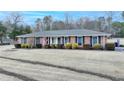 Beautiful brick home featuring classic shutters and a manicured front yard with attractive landscaping at 2111 Jade Dr, Canton, GA 30115