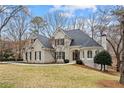Charming two-story home featuring a well-manicured lawn and an inviting entrance at 10635 N Edgewater Pl, Johns Creek, GA 30097