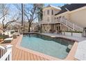A serene backyard pool with an outdoor seating area, perfect for relaxation and entertaining guests at 10635 N Edgewater Pl, Johns Creek, GA 30097
