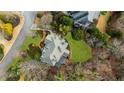 Aerial view of a well-maintained home with lush green lawn, manicured landscaping and mature trees at 2616 Boddie Pl, Duluth, GA 30097