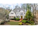 Charming two-story home featuring a landscaped front yard and inviting entrance with elegant architectural design at 2616 Boddie Pl, Duluth, GA 30097