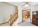 Welcoming foyer featuring a staircase, tiled floor and an open doorway to the dining area at 2999 Happy Hollow Dr, Conyers, GA 30094