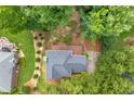 Aerial view of the home with a private backyard, wooden deck, and lush greenery at 274 Westchester Club Dr, Hiram, GA 30141