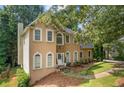 Stunning home showcasing a stone accent wall and a neatly landscaped front yard at 274 Westchester Club Dr, Hiram, GA 30141