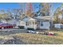 Attractive home featuring stone accents, a cozy porch, and festive holiday decorations at 3109 Meadow Wood Ct, Lawrenceville, GA 30044